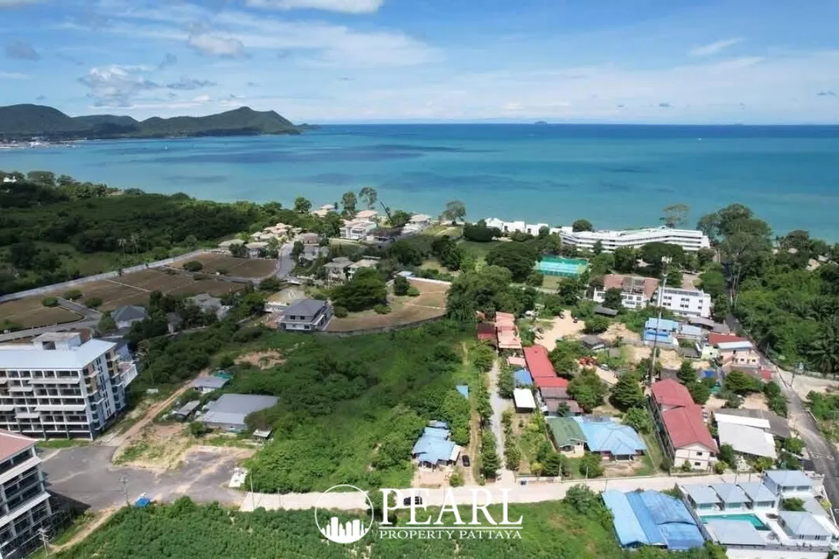 Land for Sale in L Pattaya green field with distant trees