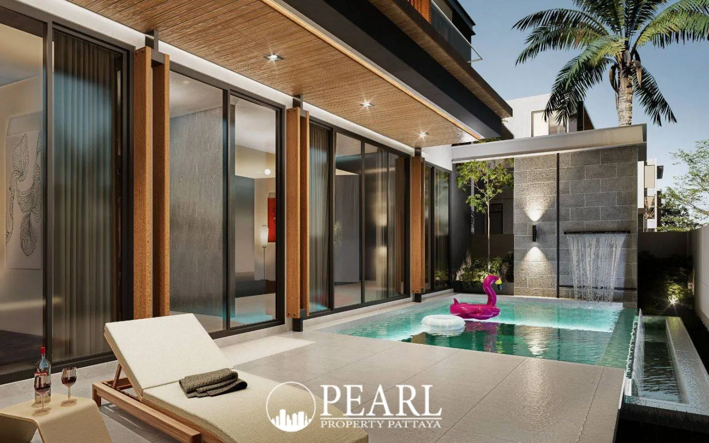 The Ozone Wealth Jomtien Pool Villa Pattaya: Private pool with waterfall feature, lounge chair, and glass sliding doors.