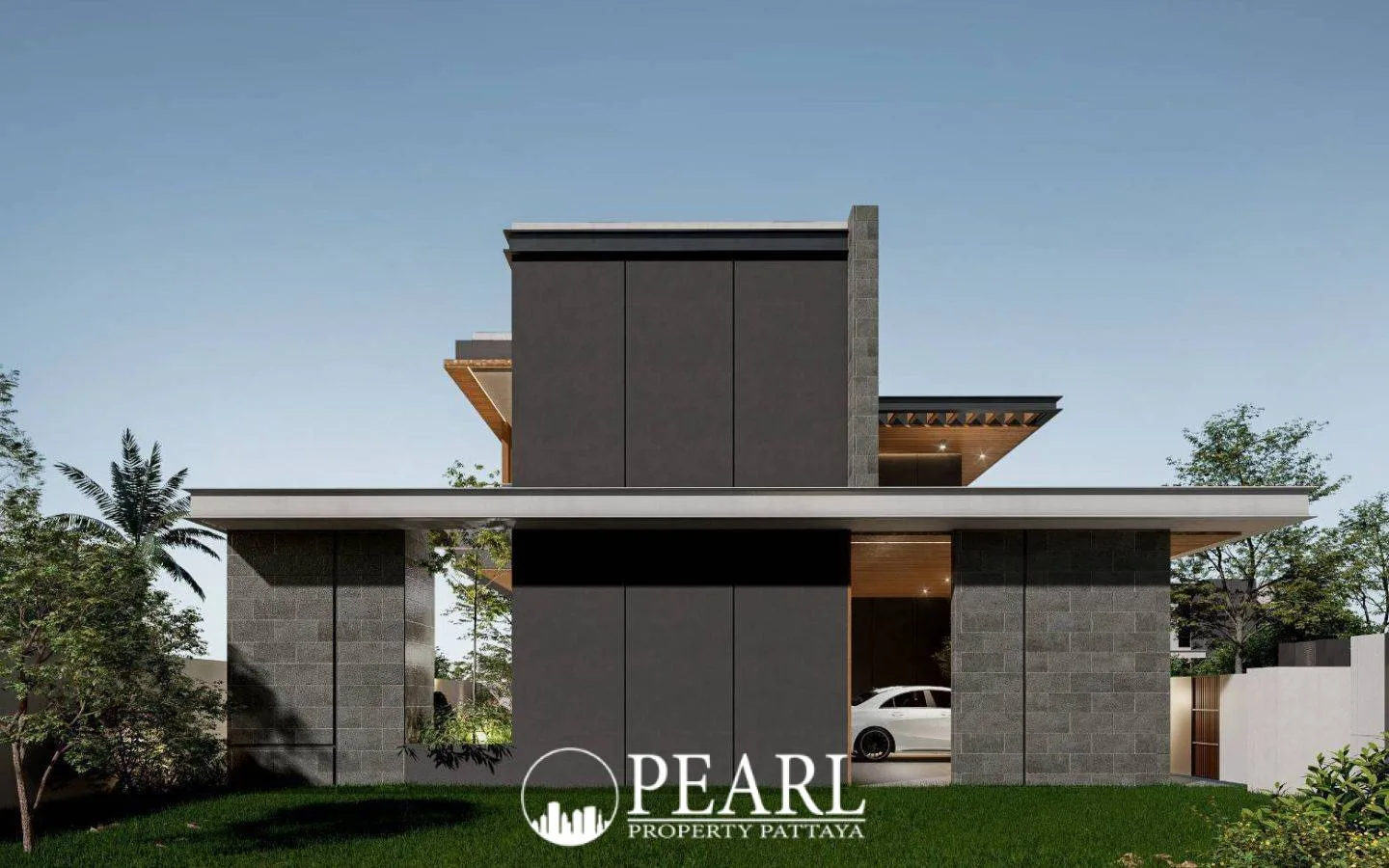 The Ozone Wealth Jomtien Pool Villa Pattaya: Modern house exterior with dark grey facade, car in garage, and green lawn.
