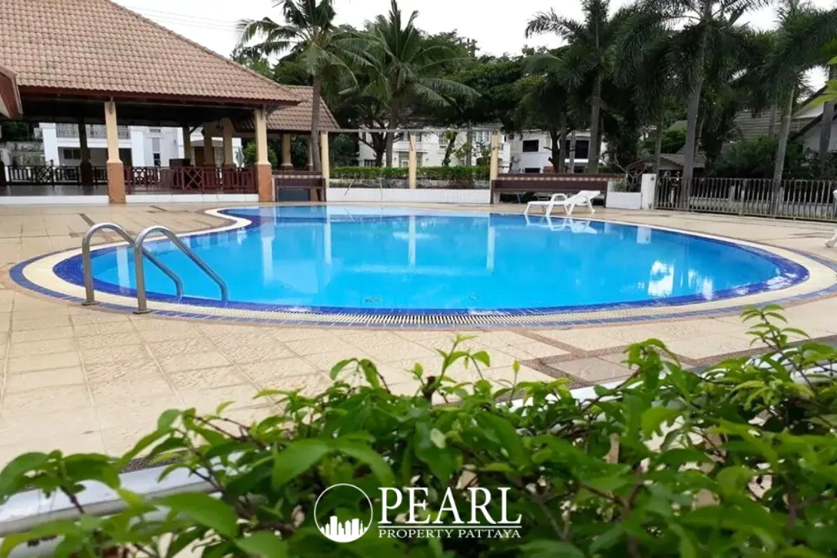 Central Park 5 Village community swimming pool with blue tiles, steps, and surrounding patio.