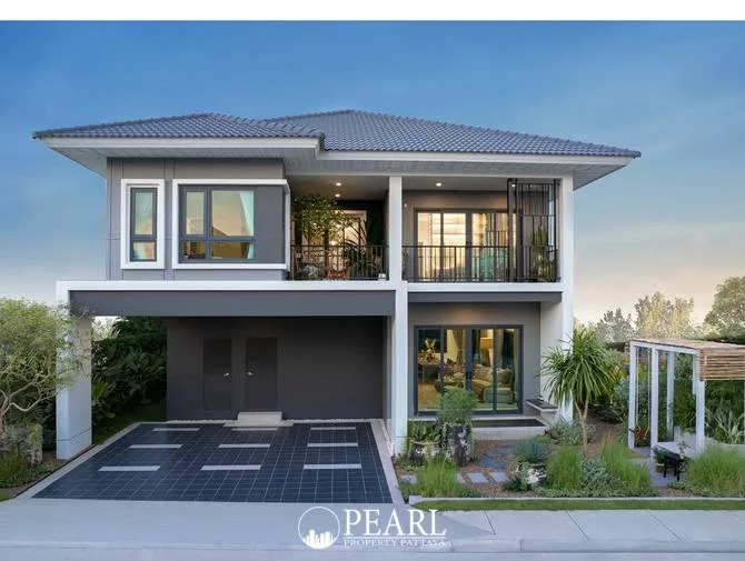 Supalai Parkville Pattaya-Sukhumvit modern two-story house exterior with gray and white facade and attached carport.