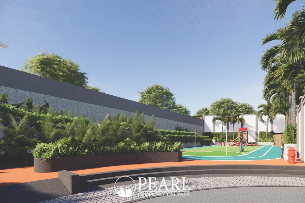 Siam Royal View Lakeside outdoor sports court with green and blue surfaces, surrounded by lush landscaping.