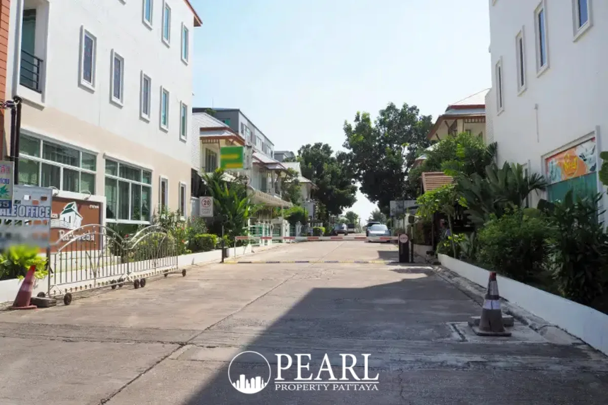 The Villa Rachawadee entrance sign featuring the property name and a house silhouette logo.