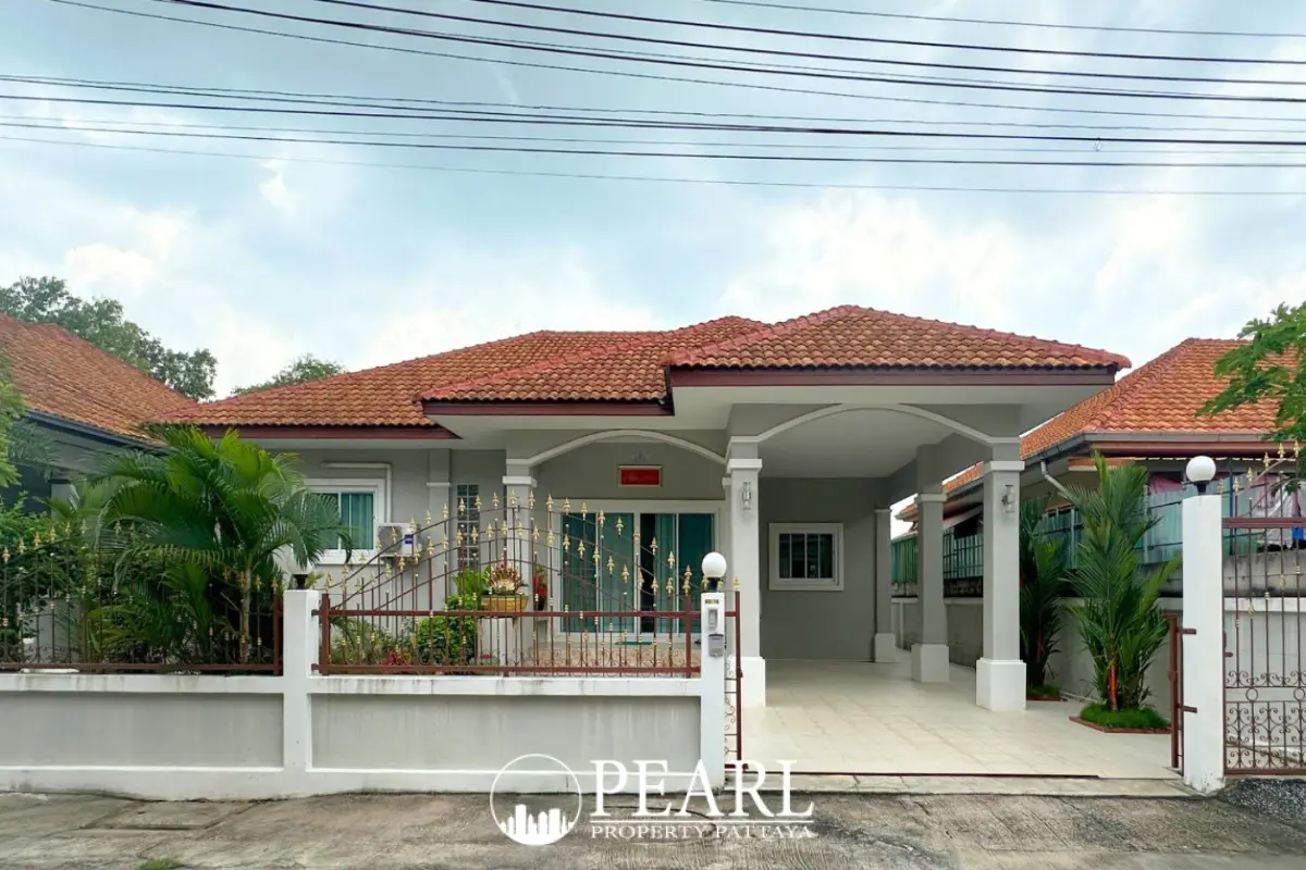 Chaiyaphruek Silver Bell Village front gate and white fence with Thai sign.