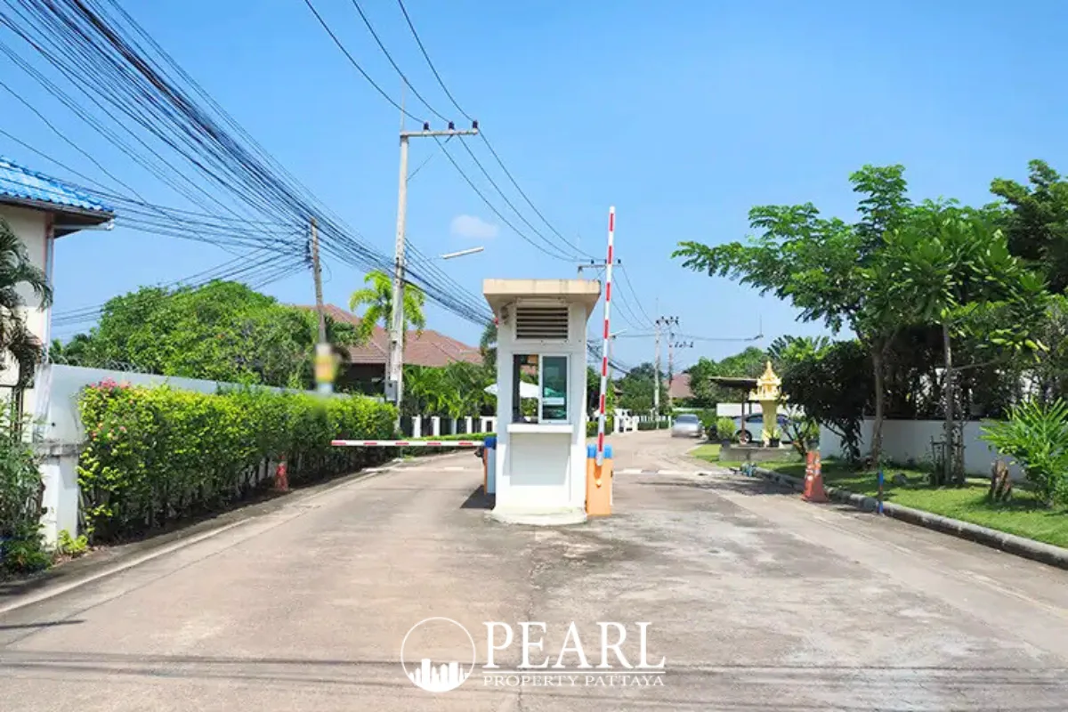 Baan Panalee gated entrance to the community with a security booth and barrier arm.