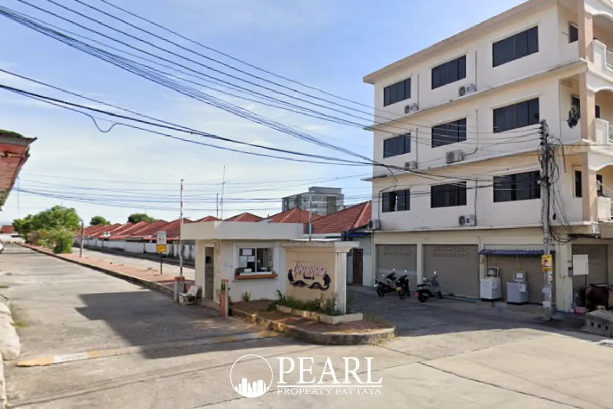 Eakmongkol 3 entrance gate with security booth, multi-story building, and street view.