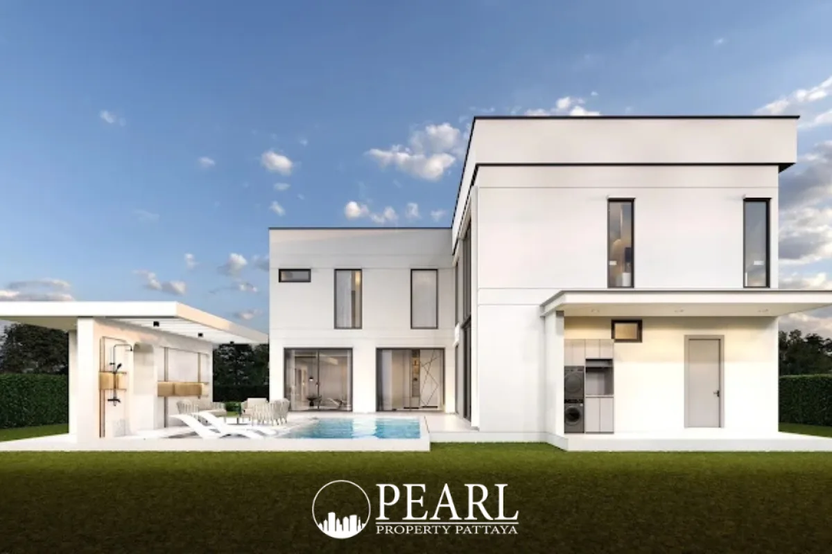 AVANI Pool Villa outdoor swimming pool area with lounge chairs, a large window facade, and lush greenery.