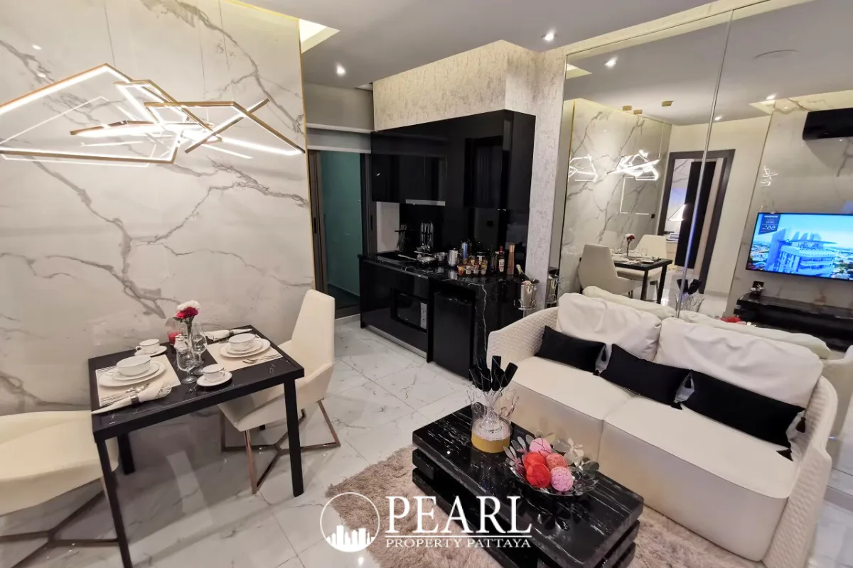 2 Bedroom Condo for Sale in Grand Solaire Pattaya master bedroom with king-size bed and ensuite bathroom