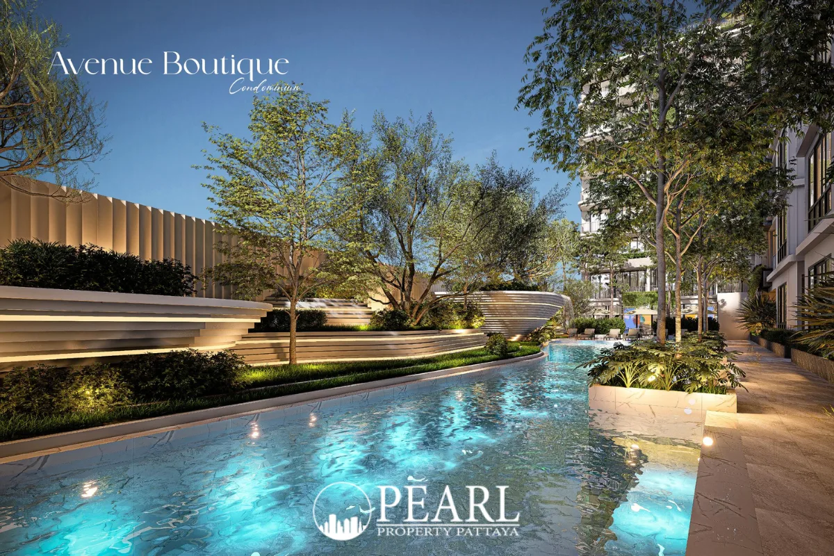 Avenue Boutique Pattaya: Outdoor swimming pool with blue lighting, surrounded by trees and modern landscaping.