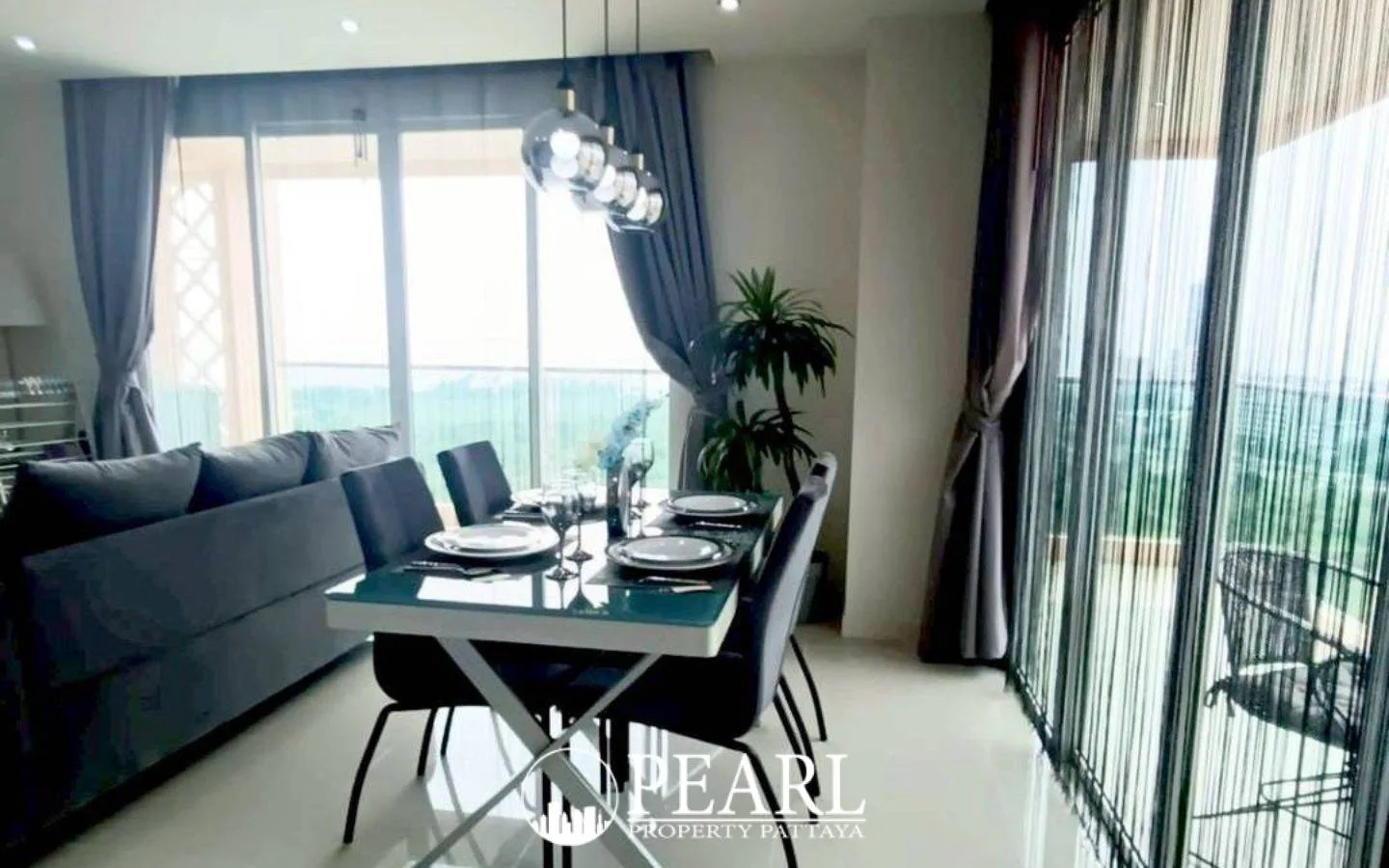 2 Bedroom Condo for Sale in Grande Caribbean master bedroom with king-size bed and balcony access