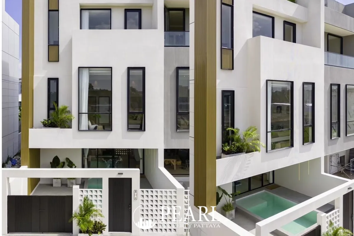 Aura Villa Reserve modern exterior with multiple levels, black-framed windows, and small plunge pool.