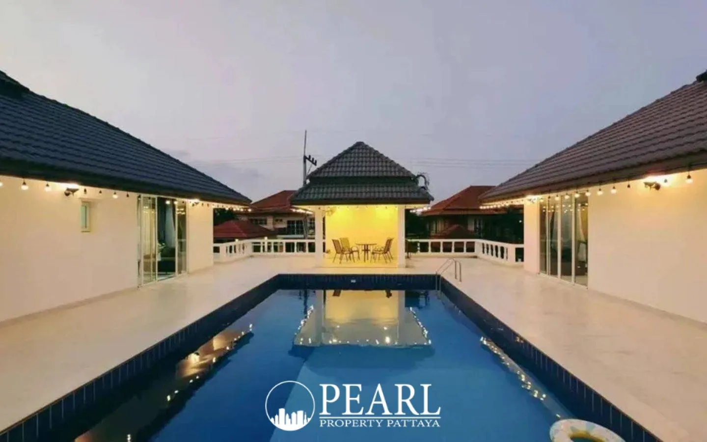 Grange Park Villa main entrance gate with security booth, palm trees, and a spirit house.