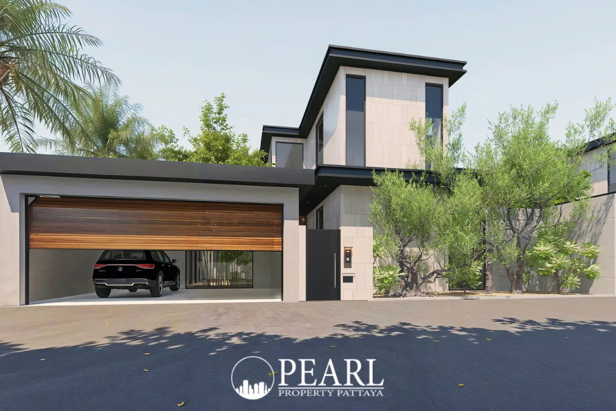 Bamboo Luxury Villa modern exterior with a large garage, black car, and lush green landscaping.