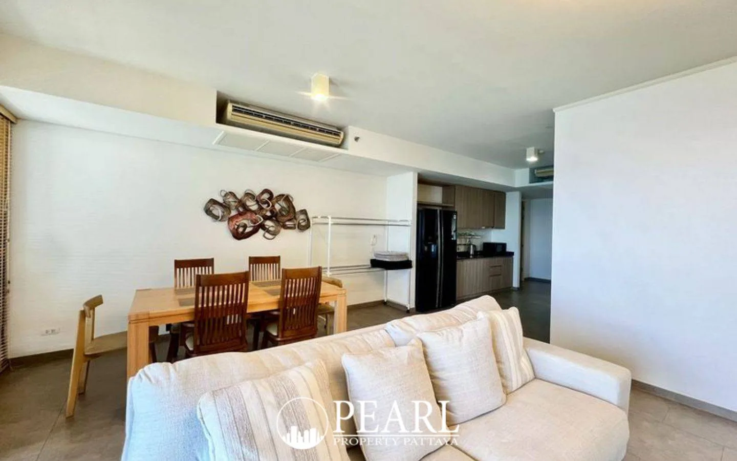 2 Bedroom Condo for Sale in Zire Wongamat dining area adjacent to the living room